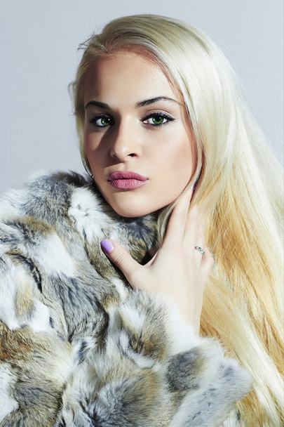 Beautiful blond woman in fur.winter fashion portrait.Beauty blond Model Girl in Rabbit Fur Coat. Woman in Luxury Fur Jacket - Photo, Image