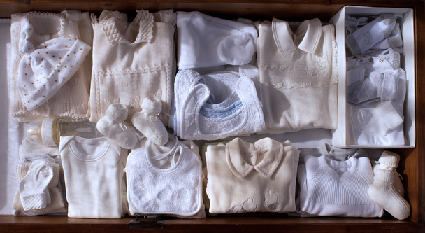 conjunto para recién nacido que viene en tono cálido
 - Foto, imagen