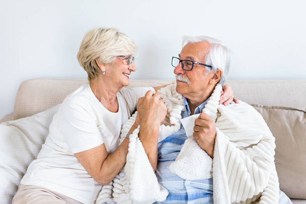 Senior man feeling sick. His wife gave him support and love - 写真・画像