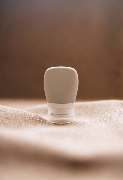 lotion tube mockup isolated on brown background. - 写真・画像