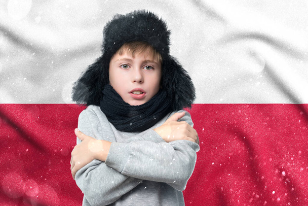 Gas crisis in Poland, Cold winter and high gas tariffs, a European schoolboy boy is freezing in the winter heating period. - Fotografie, Obrázek