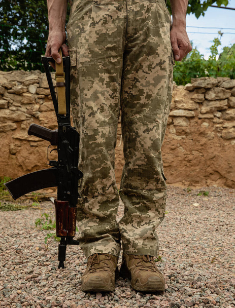 Kalashnikov assault rifle in the hands of a military man.Army. Military concept. No war. - Photo, Image