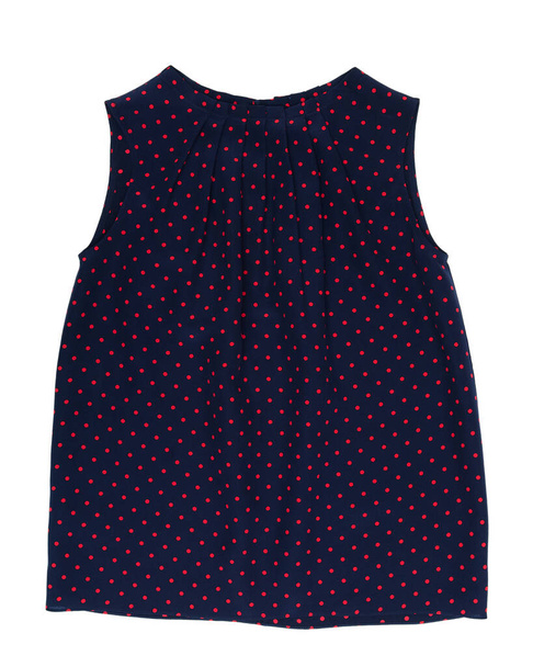 Women's sleeveless blouse with a print on blue color red circles, an object isolated on a white background - Foto, Imagen