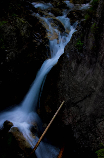 Beautiful mountain waterfall in dark colors. Tatra National Park. - Fotoğraf, Görsel