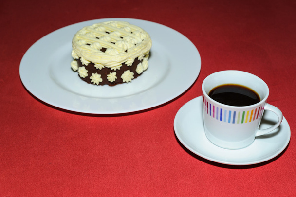 taza de café con postre cremoso
 - Foto, Imagen