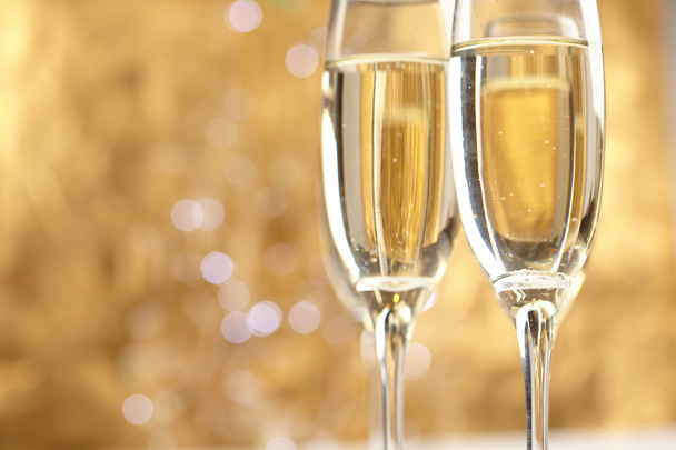 Champagne on gold background - Photo, Image
