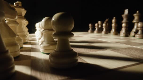 A macro shot of a shadow moving across a chess board - Imágenes, Vídeo