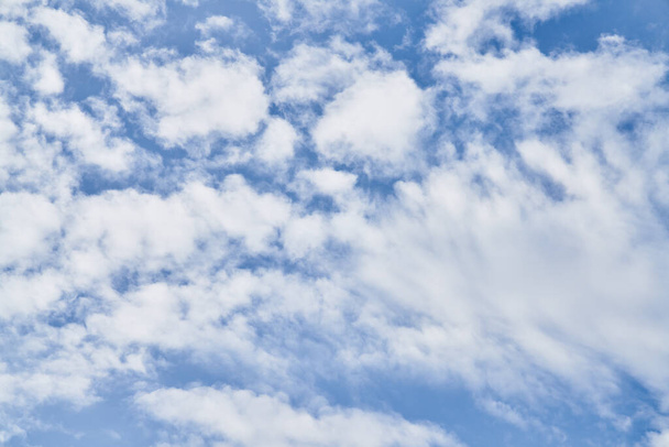 Beatiful blue sky with clouds on a sunny day - Fotó, kép
