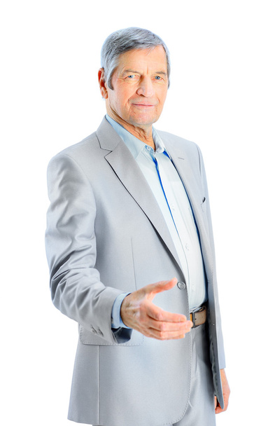 Nice businessman at the age of hand for a handshake. Isolated on a white background. - Photo, Image