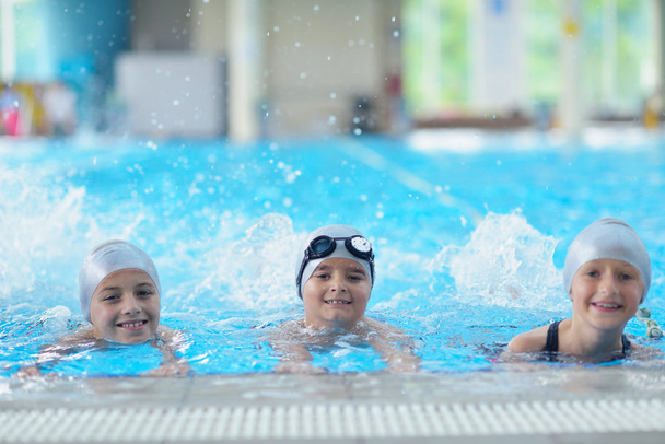 Group of happy kids at swimming pool - Photo, Image