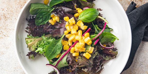 corn salad green lettuce mix fresh dish healthy meal food snack diet on the table copy space food background rustic top view keto or paleo diet veggie vegan or vegetarian food no meat - Photo, Image