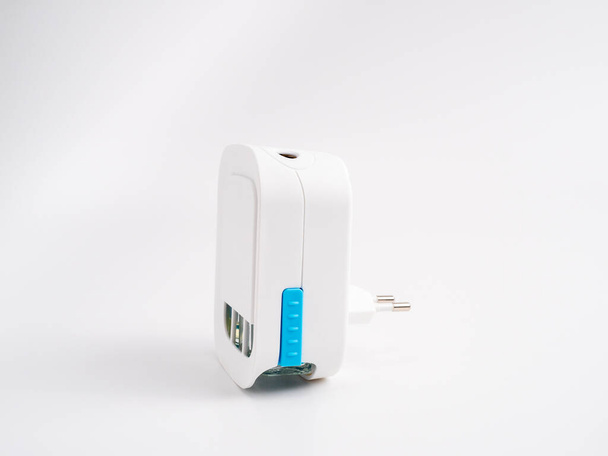Three cartridge electric air freshener on a white background. Electric air freshener circle plan. - Fotoğraf, Görsel