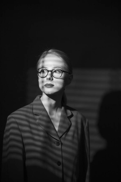 portrait of woman in noir style with shadow from blinds - Foto, immagini