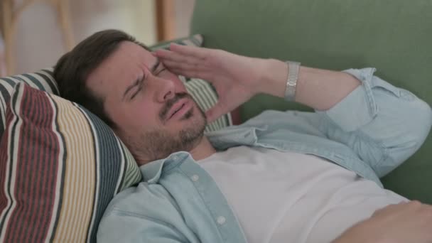Casual Man having Headache while Sleeping in Bed - Záběry, video
