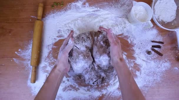 Female hands stir the brown dough by mixing it with white flour. Cooking gingerbread. Flat lay. - Metraje, vídeo