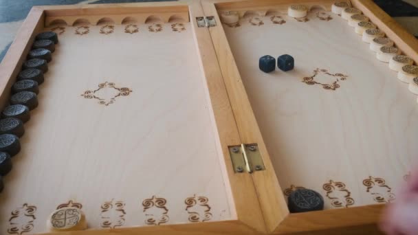 backgammon game throwing dice close-up movement of chips - Materiał filmowy, wideo