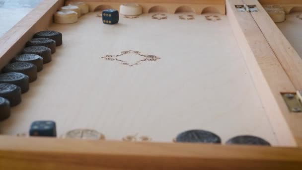 backgammon game throwing dice close-up movement of chips - Materiaali, video