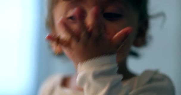 Messy baby eating with hand. Cute dirty infant child boy eats noodle with hands - Materiał filmowy, wideo