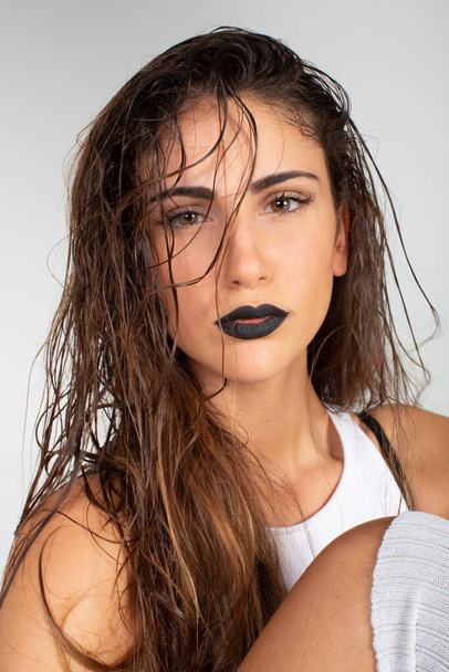 beautiful brunette italian girl with white top and black lipstick. High quality photo - Zdjęcie, obraz