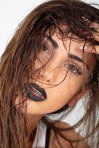 beautiful brunette italian girl with white top and black lipstick. High quality photo - Zdjęcie, obraz