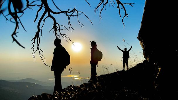 enthusiasm, success and harmonious movements of mountaineers at the summit - Valokuva, kuva
