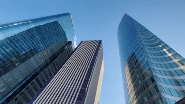 Building reflected on glass skyscraper in Paris, grey skyscraper in Paris, open glass at left, blue sky and reflections. Wide Shot. High quality 4k footage - Video