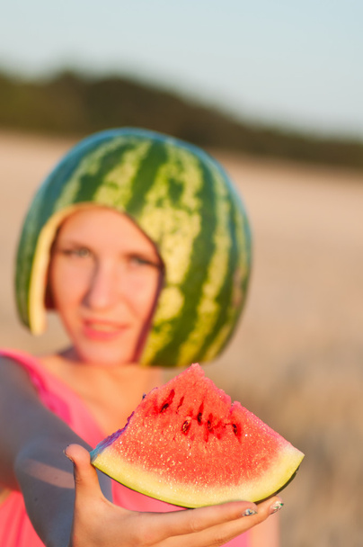 woman model with water-melon on head - Foto, Imagen