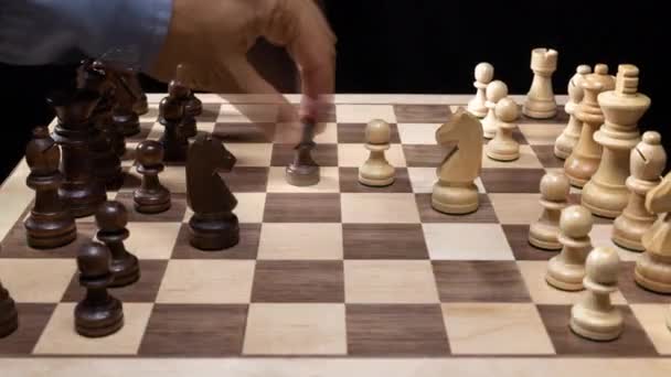 A game of chess being played in stop motion with hands moving the pieces - Video, Çekim