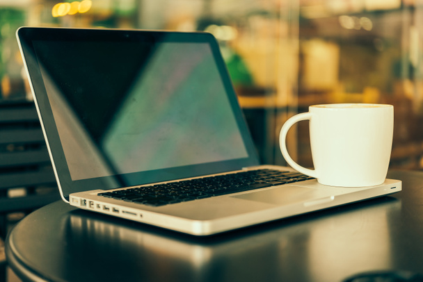 Laptop and coffee cup - Photo, Image