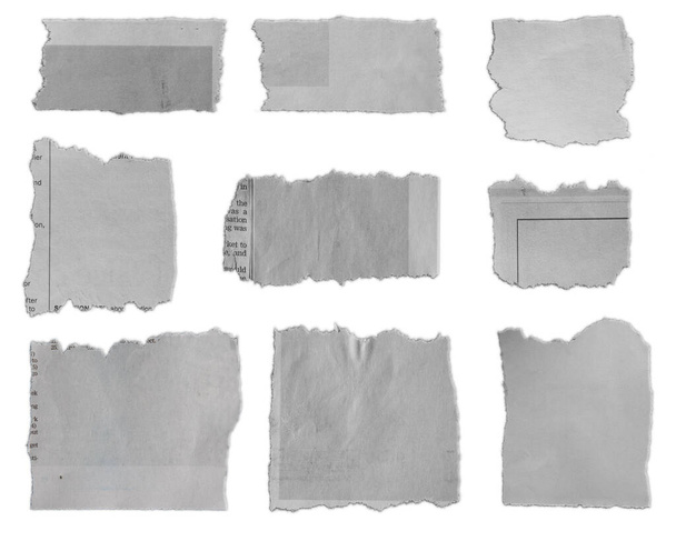 Девять кусочков рваной бумаги на обычном фоне
  - Фото, изображение