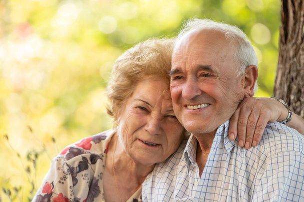 senior couple smiling happy outdoors - Foto, Imagen
