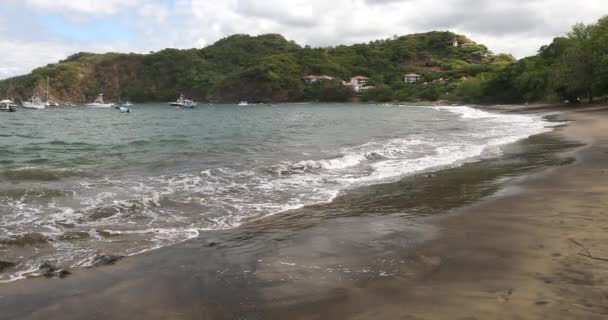 Playa Ocotal with Pacific ocean waves on sandy beach, El Coco Costa Rica. Famous snorkel beach. Picturesque paradise tropical landscape. Pura Vida concept, travel to exotic tropical country. - Footage, Video