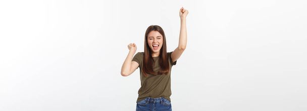 Winning success woman happy ecstatic celebrating being a winner. Dynamic energetic image of Caucasian female model isolated on white background. - Photo, Image
