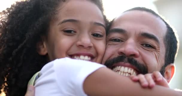 Mixed race father and daughter embrace. Little girl hugging dad, happiness concept - Video