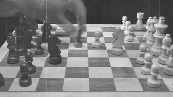 A game of chess being played with aged film overlay - Video, Çekim