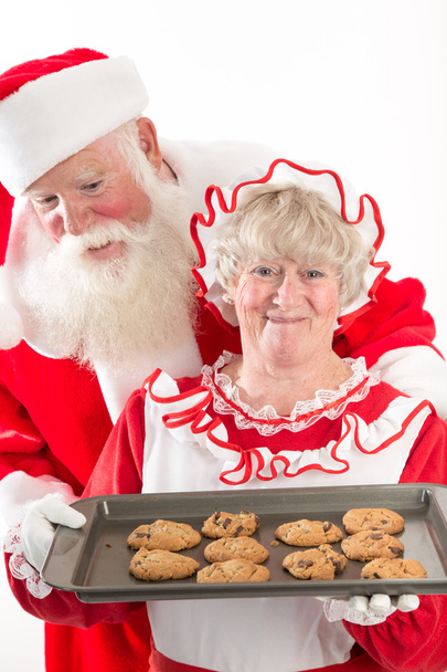 Santa Claus y la señora Santa con galletas
 - Foto, Imagen