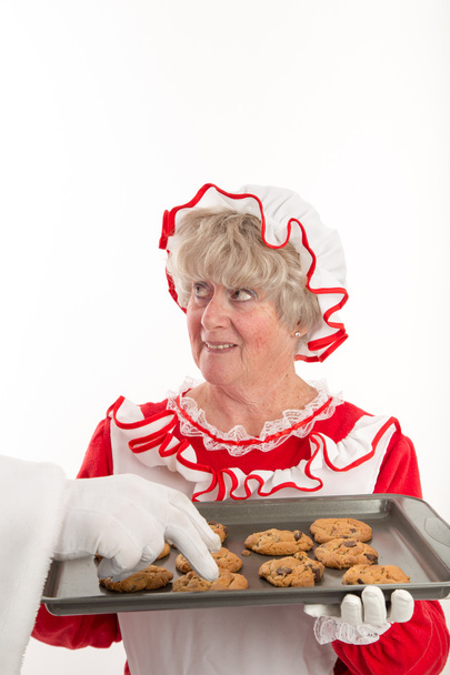 Santa's hand-hoz megragad a cookie-k elérése - Fotó, kép