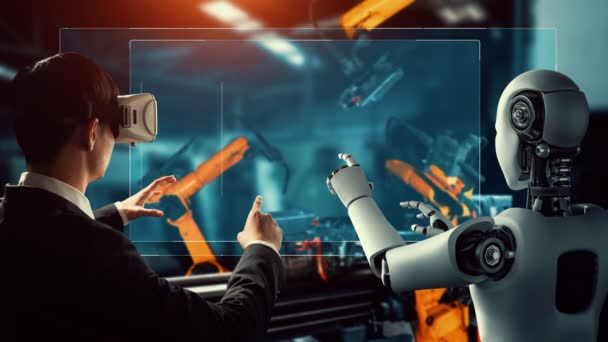 Cybernated industry robot and human worker working together in future factory . Concept of artificial intelligence for industrial revolution and automation manufacturing process . - Materiał filmowy, wideo