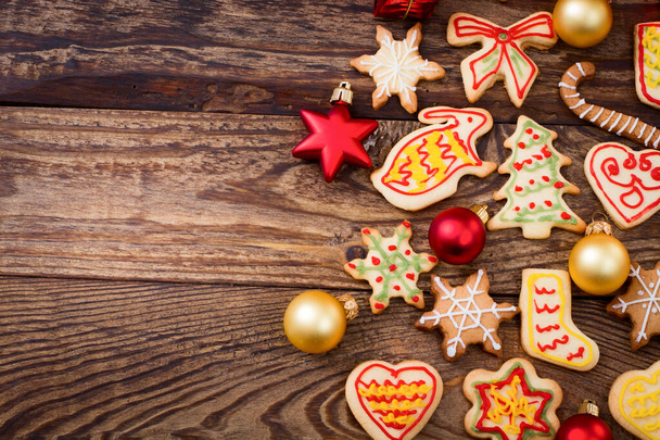 Christmas cookies on brown wooden table. Top view and mock up. - Φωτογραφία, εικόνα