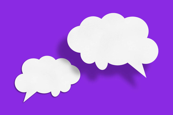 white cloud paper speech bubble shape against purple background design. - Photo, Image
