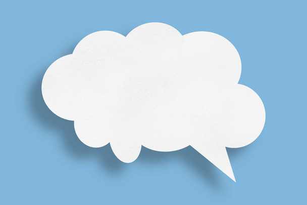 white cloud paper speech bubble shape against blue background design. - Photo, image