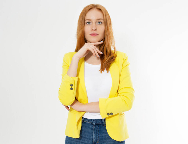 Happy beautiful young red head woman in a stylish yellow jacket copy space. Attractive red hair girl looking at camera. - Photo, image