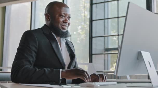 Middle aged business specialist african american man entrepreneur working on computer at office senior IT manager web designer programmer ceo agent trading online e-commerce check email data analysis - Filmmaterial, Video