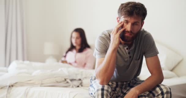 Sad couple, bedroom and fight after communication problem or divorce threat with difficult news. Toxic relationship, depression and anger about partner cheating secret and lies in marriage - Video