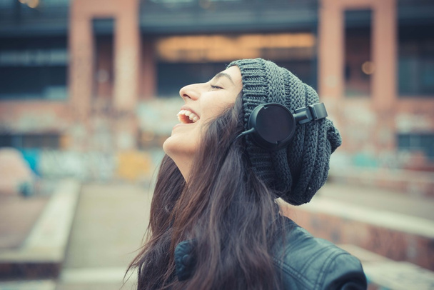 Woman listening music with headphones - Photo, Image