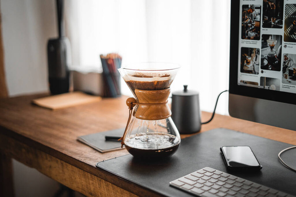 Coffee chemex pour over coffee maker and drip kettle in home office desk - Foto, immagini