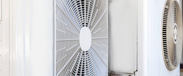 Air conditioner compressor installed outdoors. - Valokuva, kuva