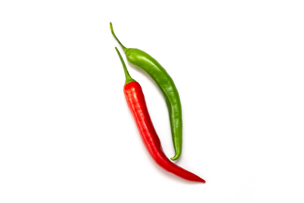 two hot peppers, red and green,  on a white background - Φωτογραφία, εικόνα