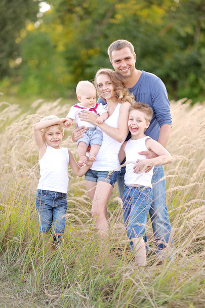 portrait of happy family relaxing in nature summer - Photo, image