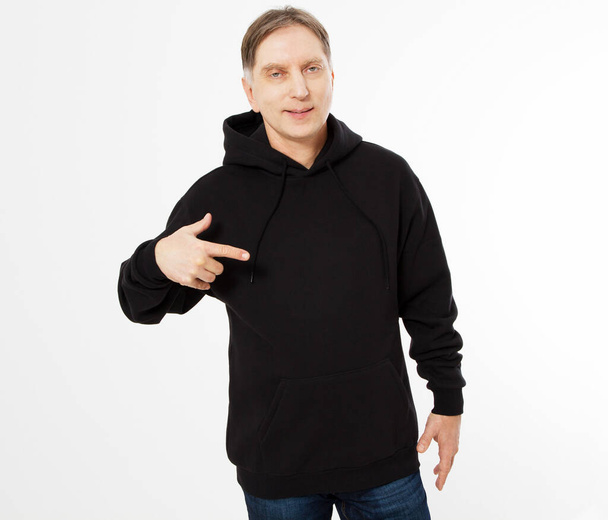 Man in black sweatshirt pointed hand, black hoodies front isolated, mock up,copy space - Foto, imagen